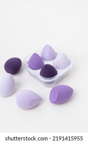 Set Of Lilac Makeup Sponges On White Background. Makeup Puff