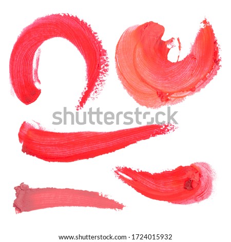 Set of lipsticks smeared on the surface. Top view. The texture of a stroke, smear, smudge of pink, red lipstick, cosmetics. Illustration isolated on white background.