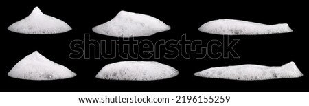 Set liquid white foam from soap or shampoo or shower gel. Abstract bubbles. isolated on a black background 
