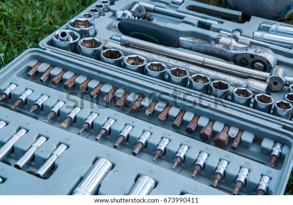 A\
set of locksmith tools for car repair in a gray\
case