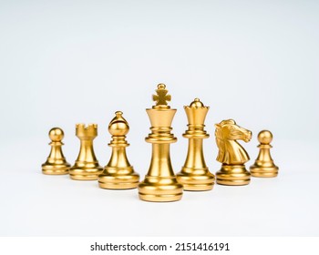 Set of luxury golden chess pieces isolated on white background. The photo of gold chess, king, rook, bishop, queen, knight, and pawn.