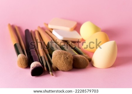 Set of Makeup Brushes on Pink Background Makeup Cosmetic Beauty Blender Silicone Sponge Above Horizontal