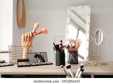 Set of makeup brushes on table in beauty salon
