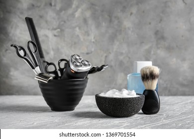 Set Of Male Shaving Accessories With Foam On Table