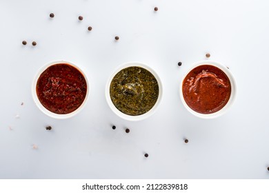 Set Marinade Sauces For BBQ Meat, Set Of Different Sauces For Barbecue, Tomato Sauce On White Background Copy Space