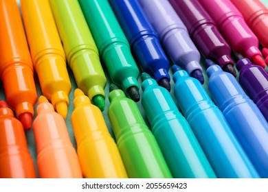 Set of markers on color background, closeup
