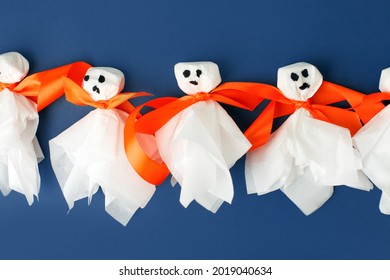 Set of materials for Halloween toys ghost from white paper napkin. Creative DIY for kids on blue. Home decor project party. Halloween crafts inspiration, recycle concept. Step by step part 4