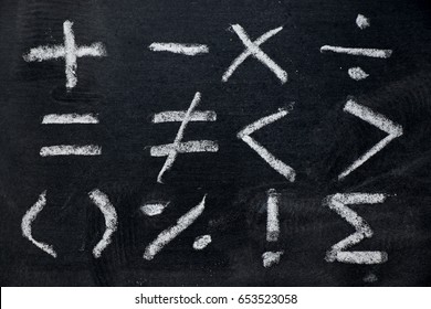 Set of math symbol draw by white chalk on blackboard background