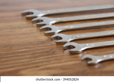 set of mechanical hand tools on wooden background