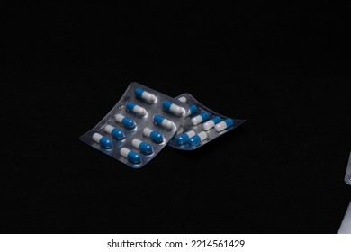 Set Of Medical Tablets And Pills In Pharmaceutical Blister Pack On Black