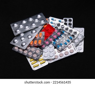 Set Of Medical Tablets And Pills In Pharmaceutical Blister Pack On Black