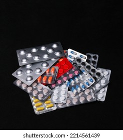 Set Of Medical Tablets And Pills In Pharmaceutical Blister Pack On Black