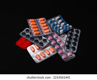 Set Of Medical Tablets And Pills In Pharmaceutical Blister Pack On Black