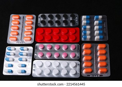 Set Of Medical Tablets And Pills In Pharmaceutical Blister Pack On Black