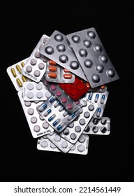 Set Of Medical Tablets And Pills In Pharmaceutical Blister Pack On Black