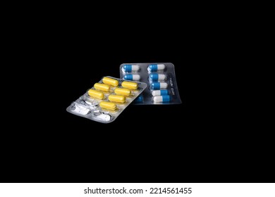 Set Of Medical Tablets And Pills In Pharmaceutical Blister Pack On Black