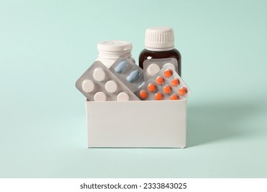 a set of medicines in a box on a colored background - Powered by Shutterstock