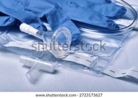 A set for men with urinary problems - a sterile urine bag with fasteners and a silicone catheter