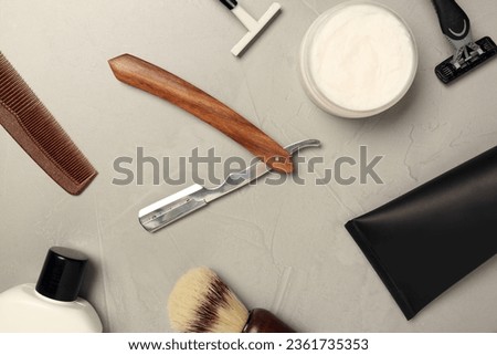 Set of men's shaving tools on light gray table, flat lay