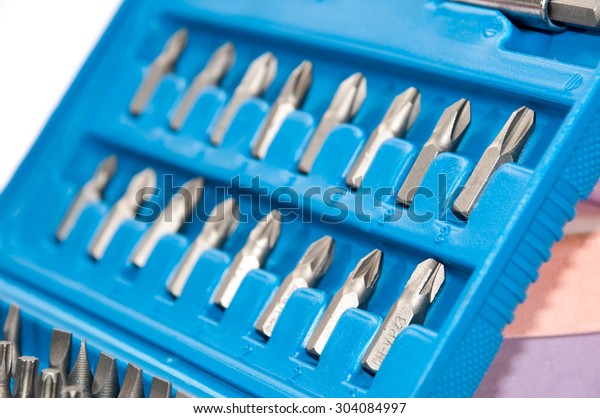 Set of metal bits in\
a blue plastic box.