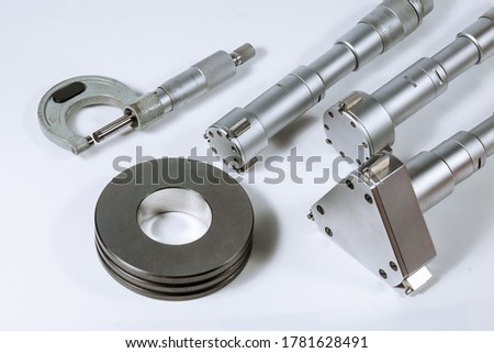Set of micrometers on a white background. Micrometer with check ring