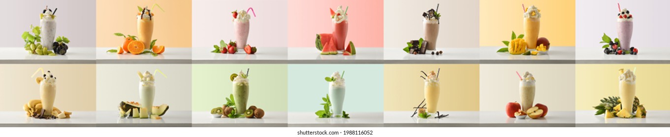 Set of milk shakes with cream in tall glass glass decorated with fruits of various flavors on white table and isolated colored background. Front view.