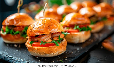 A set of mini burgers on a board in a restaurant. - Powered by Shutterstock