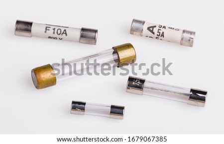 Set of miniature electrical fuses for overcurrent protection in electronics. Safety electronic components group. Metal fusible wire or strip between two terminals enclosed in ceramic or glass tubes.