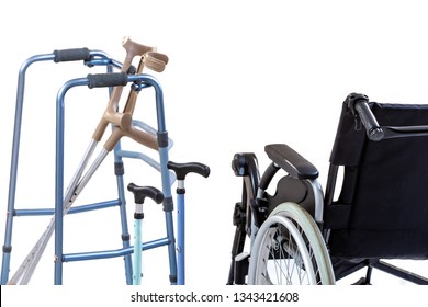 Set Of Mobility Aids Including A Wheelchair, Walker, Crutches, Quad Cane, And Crutches.