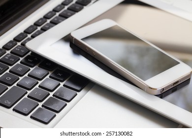 set of modern computer devices  - laptop, tablet and phone close up