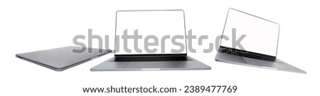  Set of modern laptops front view, flying and close isolated on white background