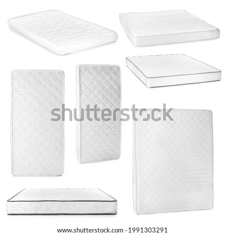 Set of modern orthopedic mattresses on white background