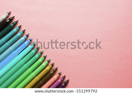 Set of multicolor felt-tip pens, markers on pink background; colorful felt pens 