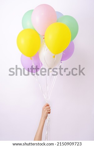 Set of multicolored helium balloons, element of decorations for Birthday party, wedding, festival, bunch of colorful pastel balloons in hand