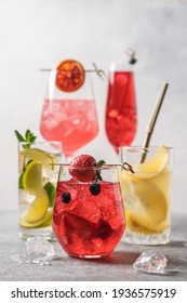 Set of multicolored summer drinks. Mojito, lemonade, red orange, berry, strawberry lemonade or cocktail with iced