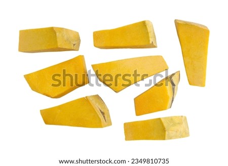 Set of multiple different piece of pumpkin on a white background with clipping path. Fresh pumpkin cut into small pieces, Top view