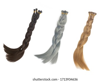 Set Of Multiple Fake Women Hair Extensions In Tails, Isolated On White Background. Dark Blonde, Brown And Silver Color. And Different Attachment Types.