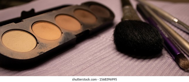 Set Of Multi-size Makeup Artist Brushes Laying In A Line In A Professional Bag