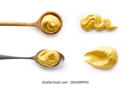 Set of mustard in spoons isolated on white background top view