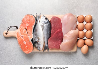 Set of natural food high in protein on grey background, top view - Shutterstock ID 1269525094