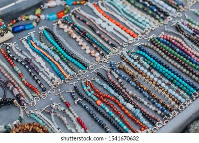Set of natural material jewellery bracelets and necklaces on the market display - Shutterstock ID 1541670632