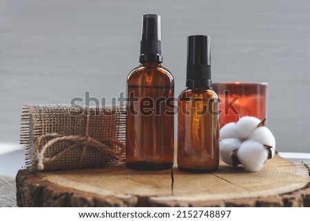 Set of natural oils for face and body care on a wooden background. SPA concept.