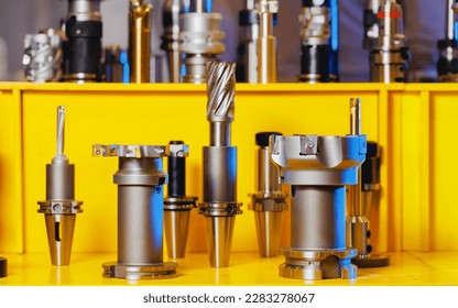 Set new drills and cutters for automatic metal processing CNC machine. Industrial tool equipment for iron factory. - Powered by Shutterstock