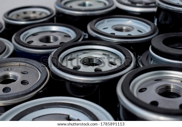 A set\
of new oil filters. Car oil filter\
background