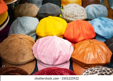 Set Of Newsboy Cap On Stall In Market