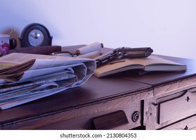 Set of newspapers on top of an old desk table, representing investigative and crime journalism, as a concept for World Press Freedom Day.