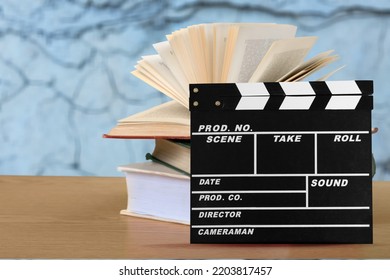 Set Od Books And Movies Slate On The Desk