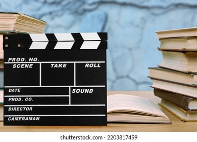 Set Od Books And Movies Slate On The Desk