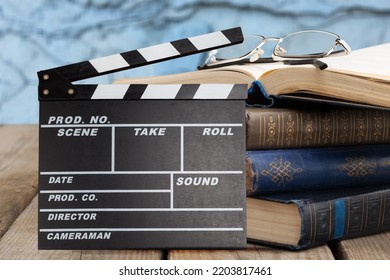 Set Od Books And Movies Slate On The Desk