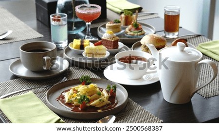 A set off snacks on a table with pasta, coffee, and tea at hotel high tea  